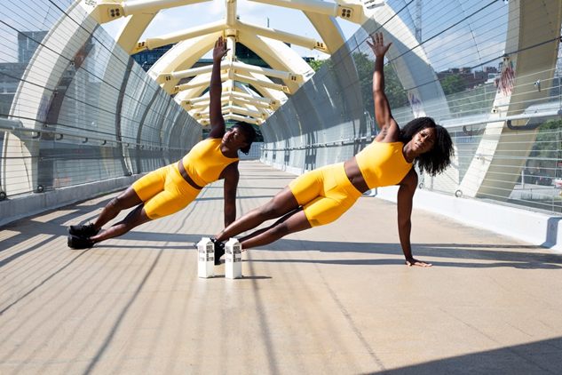 Two women working out outdoors